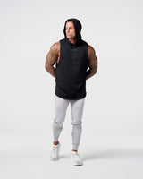 Front view of Limitless Men’s Sleeveless Hoodie in black with hood, split hem, and reflective chest logo.