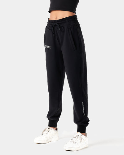 Women’s Breathe Joggers in black, featuring a minimalist reflective Lyftlyfe logo, thick waistband, and a tapered fit for a flattering silhouette.