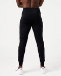 Back view of men’s black Breathe Joggers with a tapered fit, ergonomic construction, and lightweight breathable fabric.