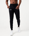 Lightweight black men’s joggers with sweat-wicking fabric, a relaxed fit, and performance-enhancing features.