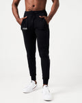 Lightweight black men’s joggers with sweat-wicking fabric, a relaxed fit, and performance-enhancing features.