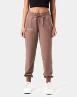 Women’s Breathe Joggers in brown, featuring a minimalist reflective Lyftlyfe logo, thick waistband, and a tapered fit for a flattering silhouette.