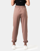 Back view of women’s Breathe Joggers in brown, showcasing a tapered design and thick waistband for a secure fit.