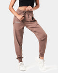 Women’s performance Joggers in brown, featuring a minimalist reflective Lyftlyfe logo and a thick waistband.