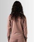 Back view of Women's performance zip-up jacket in brown, crafted from moisture-wicking, lightweight fabric for mobility.