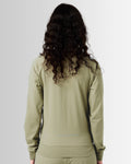 Back view of women’s green Breathe Zip-Up Jacket featuring ergonomic construction, lightweight breathable fabric, and seamless design.