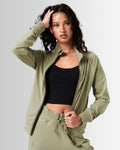 Women’s Breathe Zip-Up Jacket in green, designed for comfort and performance with a sleek fit.