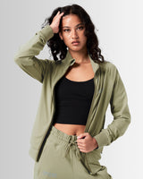 Women’s Breathe Zip-Up Jacket in green, designed for comfort and performance with a sleek fit.