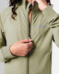 Detailed view of the neck and zipper design on women’s streamlined zip-up jacket in green.