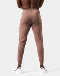 Back view of men’s brown Breathe Joggers with a tapered fit, ergonomic construction, and lightweight breathable fabric.