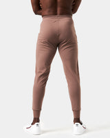 Back view of men’s brown Breathe Joggers with a tapered fit, ergonomic construction, and lightweight breathable fabric.