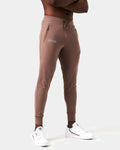 Right side view of brown men’s joggers with a reflective logo near the right pocket and stretch fabric for optimal movement.