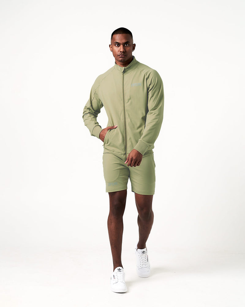 Light green shorts with a drawstring on a white background