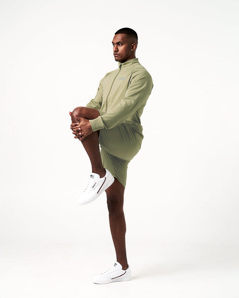 Light green shorts with a drawstring on a white background
