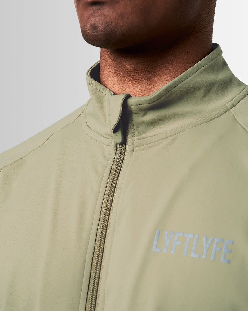 Light green jacket with a brand logo on a white background