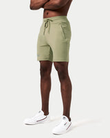 Green men’s shorts with 4-way stretch material and invisible pocket detail.