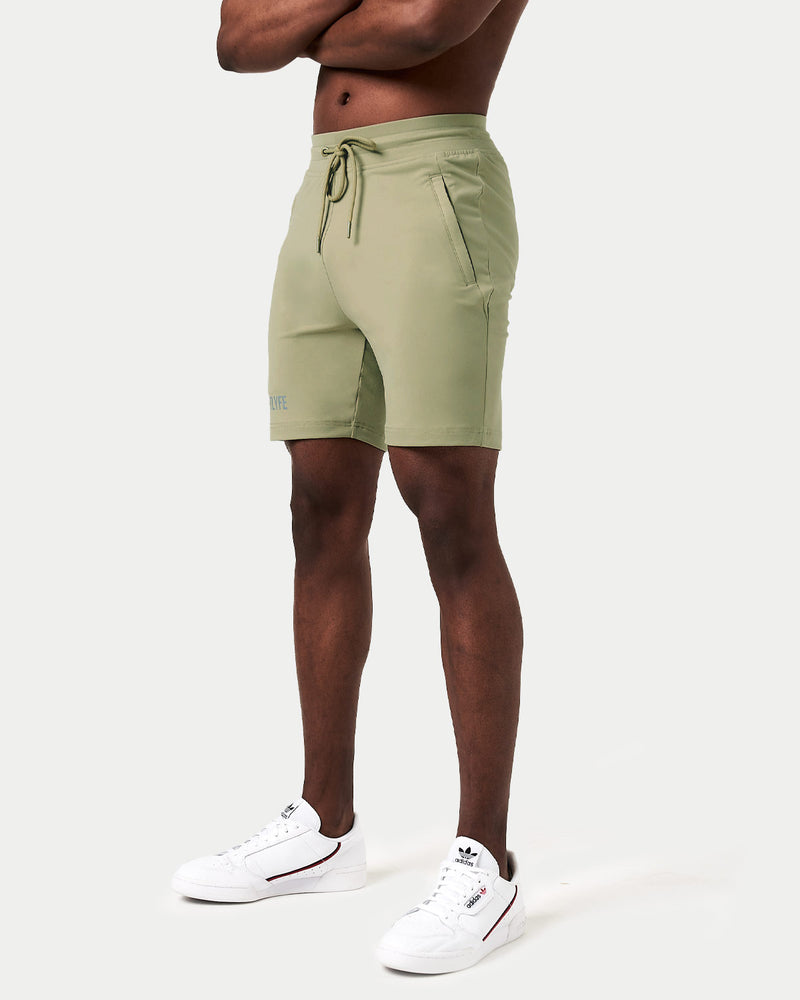 Light green shorts with a drawstring on a white background