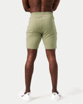 Back view of men’s breathable performance shorts in green with tapered design and durable moisture-wicking material.