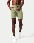 Men’s Breathe Shorts in green featuring a minimalist reflective Lyftlyfe logo, wide waistband, and adjustable tonal drawstring.