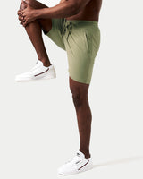 Men’s Breathe Shorts in green, featuring lightweight 4-way stretch fabric, and ergonomic design for unrestricted movement.