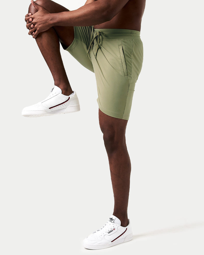 Light green shorts with a drawstring on a white background