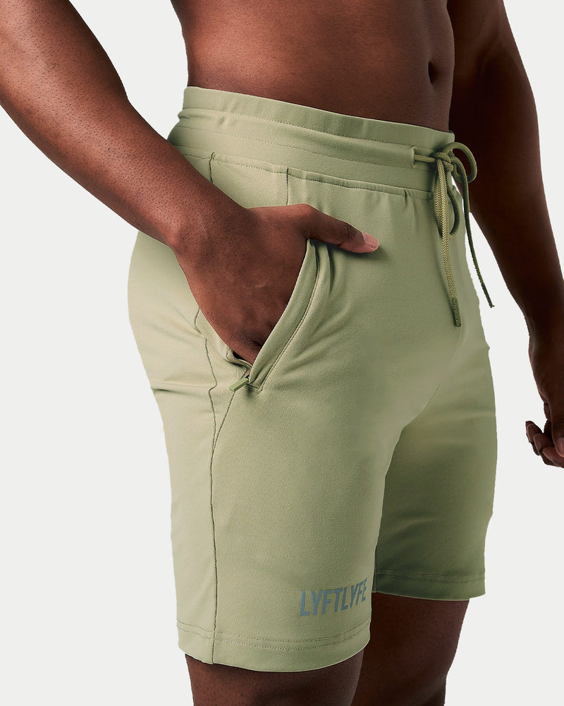 Light green shorts with a drawstring on a white background