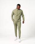 Lightweight green men’s joggers with sweat-wicking fabric, a relaxed fit, and performance-enhancing features.