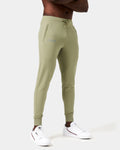 Side view of men’s Breathe Joggers in green featuring the reflective LYFTLYFE logo on the right thigh and secure zippered pockets.