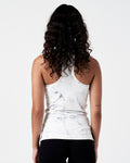 Back view of women’s LYFTLYFE white marble tank showing racer cut and stretch fabric.
