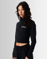 Left Side view of Breathe Women’s Zip-Up Crop in black, highlighting the ergonomic fit, custom zipper closure, and breathable fabric.