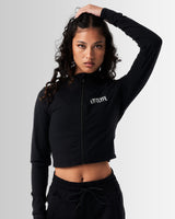 Women’s Zip-Up Crop in black, featuring a reflective Lyftlyfe logo on the left chest and a cropped silhouette for a flattering fit.