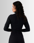 Back view of Breathe Women’s Zip-Up Crop in black, showcasing the cropped silhouette and sleek, breathable fabric.
