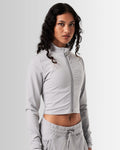 Right Side view of women’s light grey zip-up crop top, emphasizing its shaping silhouette and lightweight design for comfort.