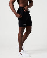Side angle of black men’s shorts with reflective branding and a secure zippered pocket. 