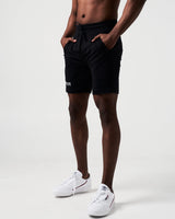 Side view of men’s black Breathe Shorts showcasing ergonomic design, moisture-wicking fabric, and secure zippered pocket.
