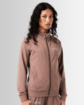 Left side view of Women's performance zip-up jacket in brown, crafted from moisture-wicking, lightweight fabric for mobility.
