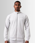 Front view of men’s light grey Breathe Zip-Up Jacket featuring a reflective Lyftlyfe logo on the left chest and a sleek, athletic fit.