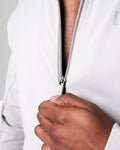 Detailed shot of the zipper design on men’s light grey performance jacket with lightweight breathable fabric.