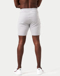 Back view of men’s breathable performance shorts in light grey with tapered design and durable moisture-wicking material.