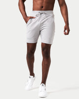 Front view of men’s light grey Breathe Shorts featuring a minimalist reflective Lyftlyfe logo, wide waistband, and adjustable tonal drawstring.