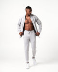 Men’s ergonomic light grey joggers with a high-performance fabric blend and the Lyftlyfe logo near the right pocket.
