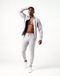 Men’s light grey Breathe joggers featuring deep invisible pockets with locking zippers and a sleek fit.