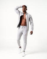 Men’s light grey Breathe joggers featuring deep invisible pockets with locking zippers and a sleek fit.