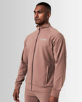 Left side view of brown men’s athletic jacket with secure invisible pocket, locking zipper, and minimalist reflective branding.