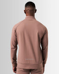 Back view of men’s brown Breathe Zip-Up Jacket with ergonomic construction, lightweight breathable fabric, and seamless design.