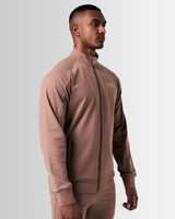 Right side view of brown men’s athletic jacket with secure invisible pocket, locking zipper, and minimalist reflective branding.