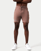 Front view of men’s brown Breathe Shorts featuring a minimalist reflective Lyftlyfe logo, wide waistband, and adjustable tonal drawstring.