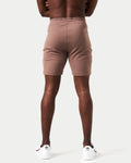 Back view of men’s brown Breathe Shorts featuring 4-way stretch fabric and minimalistic styling for performance.