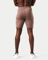 Back view of men’s brown Breathe Shorts featuring 4-way stretch fabric and minimalistic styling for performance.