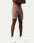 Right side view of brown men’s shorts with 4-way stretch material, reflective branding, and invisible pocket detail.